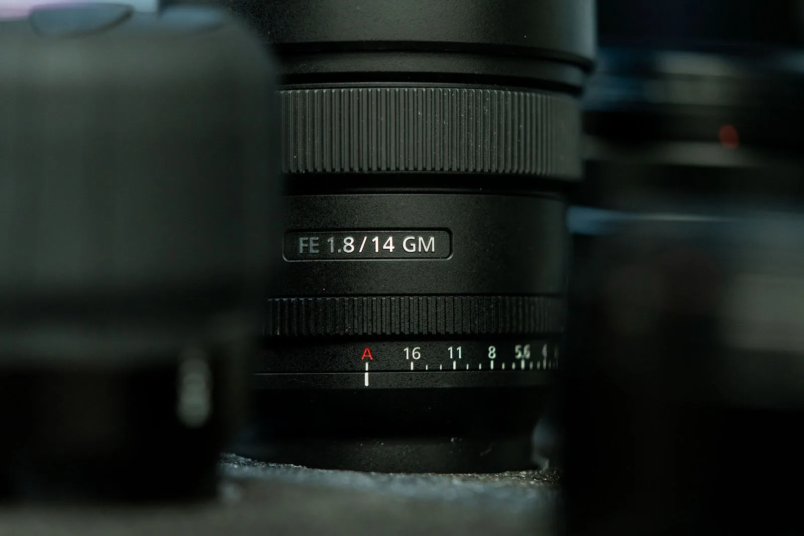 Close-up of a Sony FE 14mm f1.8 GM lens with more of the Bang Media camera kit behind it